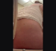 A hidden camera behind a toilet records a mature, plump woman sitting down, farting, pissing, and then shitting with audible plops. Vertical format video. Over a minute.